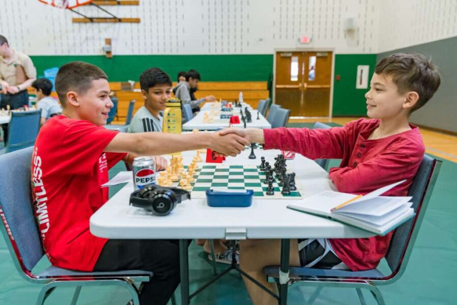 WES00870 Two chess buddies turn rivals as they meet to do battle on the chess board in the Championship section.